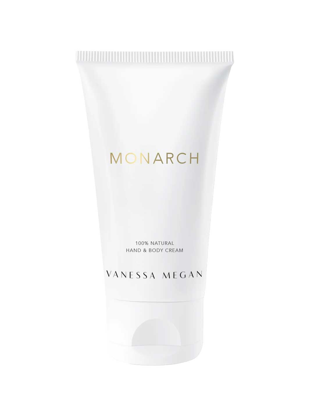 A white tube of Vanessa Megan Perfume Hand & Body Cream Monarch 50ml stands upright against a white background. The minimalist packaging with gold and black text highlights this luxurious, organic hand and body cream.