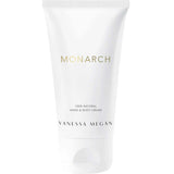 A white tube of Vanessa Megan Perfume Hand & Body Cream Monarch 50ml stands upright against a white background. The minimalist packaging with gold and black text highlights this luxurious, organic hand and body cream.