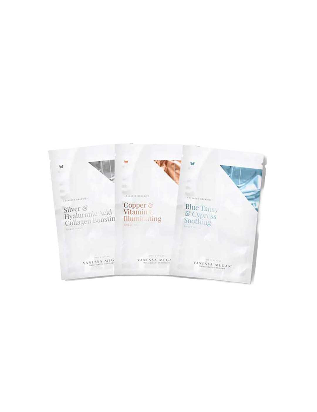 Three Vanessa Megan Silver, Copper & Blue Sheet Mask Trio sachets stand upright in a row, each featuring minimalist text: Silver & Hyaluronic Acid Collagen Boosting, Copper & Vitamin Illuminating, and Blue Tansy & Cypress Soothing.