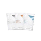 Three Vanessa Megan Silver, Copper & Blue Sheet Mask Trio sachets stand upright in a row, each featuring minimalist text: Silver & Hyaluronic Acid Collagen Boosting, Copper & Vitamin Illuminating, and Blue Tansy & Cypress Soothing.