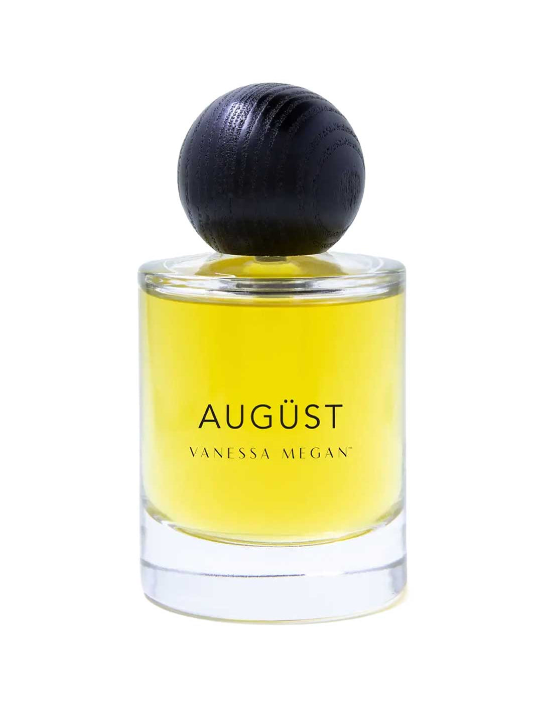 The Vanessa Megan Augüst 100% Natural Eau de Parfum (50ml) is a clear glass bottle with yellow liquid, a large round dark cap, and contains botanical perfume inspired by Australian bush scents.