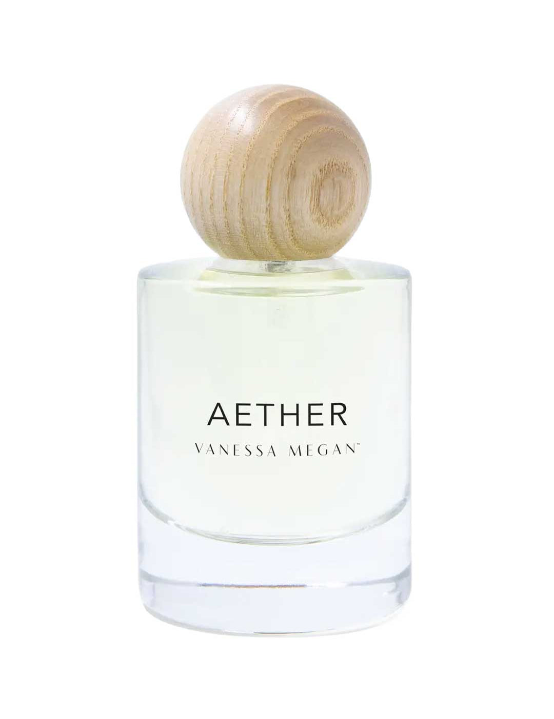 A clear glass bottle labeled Vanessa Megan Aether 100% Natural Eau de Parfum 50ml, with light yellow perfume and a round light wood cap, handcrafted in Australia, sits against a white background.