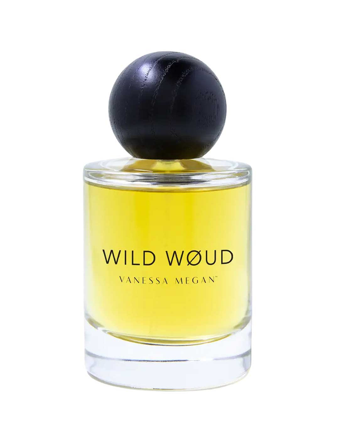 A clear glass bottle of Vanessa Megan Wild Wøud 100% Natural Eau de Parfum 50ml, with yellow liquid and a round black cap, is labeled Vanessa Megan and stands against a white background.