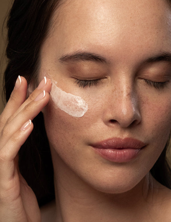 Model applying Antipodes Vanilla Pod Hydrating Day Cream