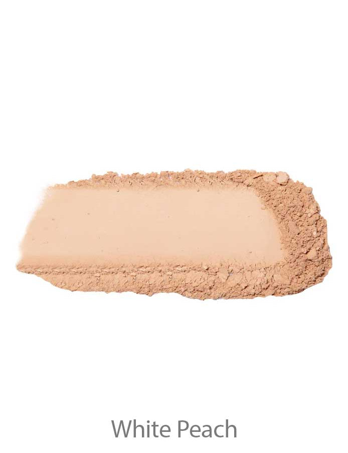 A swatch of 100% Pure Rice Powder Foundation 9g in light beige, partially smoothed with visible texture, labeled White Peach below.