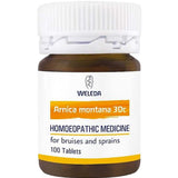 Weleda Arnica Montana 30c 100 Tablets come in a brown bottle with a white cap and a white-yellow label, designed for bruising relief and sprains.
