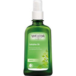 A green glass bottle of Weleda Birch Cellulite Oil 100ml with a white pump dispenser. The label displays the brand name, product name, and an illustration of birch leaves.