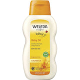 A 200 ml white plastic bottle of Weleda Calendula Baby Oil Fragrance Free with a yellow cap and label decorated with calendula flowers; the label states it’s for delicate skin.
