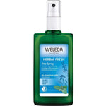 Weleda Herbal Fresh deodorant spray bottle on a white background