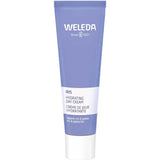 A purple and white 30ml tube of Weleda Iris Hydrating Day Cream, a moisturiser for dry, dehydrated skin, with the brand name and product details displayed in white text on the front.