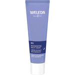 A 30ml blue tube of Weleda Iris Regenerating Night Cream with white and light blue text stands upright on a white background—ideal for sensitive skin and overnight moisture restoration, with organic iris and chamomile.