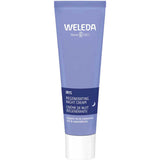 A 30ml blue tube of Weleda Iris Regenerating Night Cream with white and light blue text stands upright on a white background—ideal for sensitive skin and overnight moisture restoration, with organic iris and chamomile.