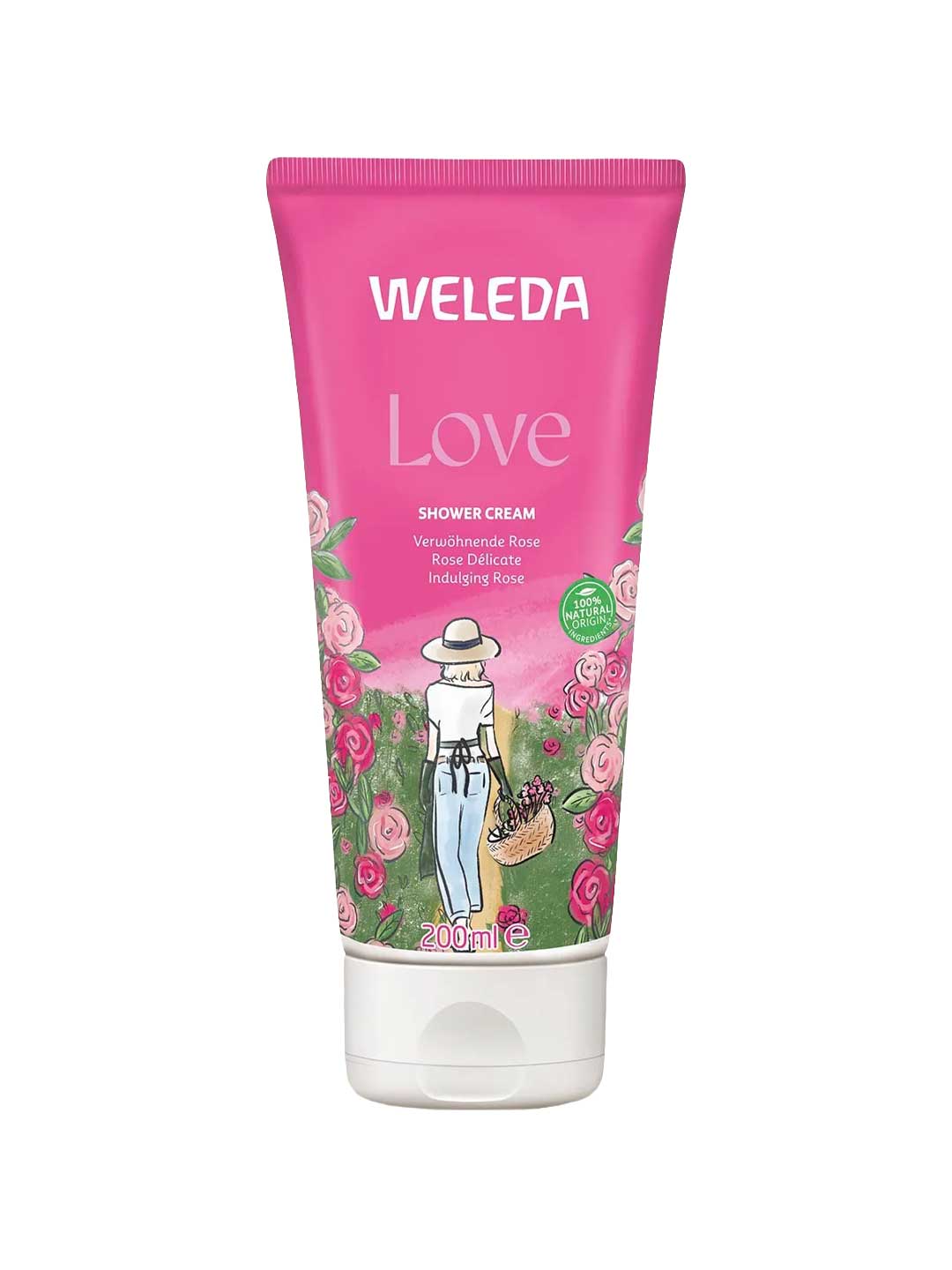 A pink tube of Weleda Love Shower Cream - Rose (200ml) features a woman in a white hat and dress with a basket in a rose garden. This body wash contains natural damask rose essence.
