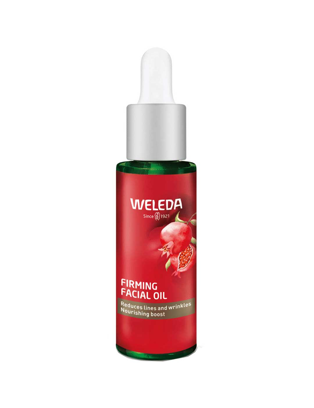 A green glass bottle of Weleda Pomegranate Firming Facial Oil 30ml with a white dropper cap and red label featuring a pomegranate image, highlighting pomegranate seed oil for reducing lines and nourishing mature skin.