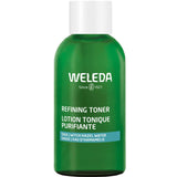 A green 150ml bottle of Weleda Refining Toner with a white cap and label reads “WELEDA Since 1921 Refining Toner Sage.” This clarifying toner uses witch hazel water to refine pores for a fresh, purified complexion.