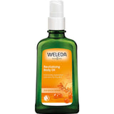 A green 100ml bottle of Weleda Revitalising Body Oil Sea Buckthorn with a white pump and orange label featuring sea buckthorn berries. The label highlights its ability to intensively replenish and care for dry skin, promoting enhanced skin moisture.