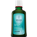 Weleda revitalizing hair tonic bottle on a white background