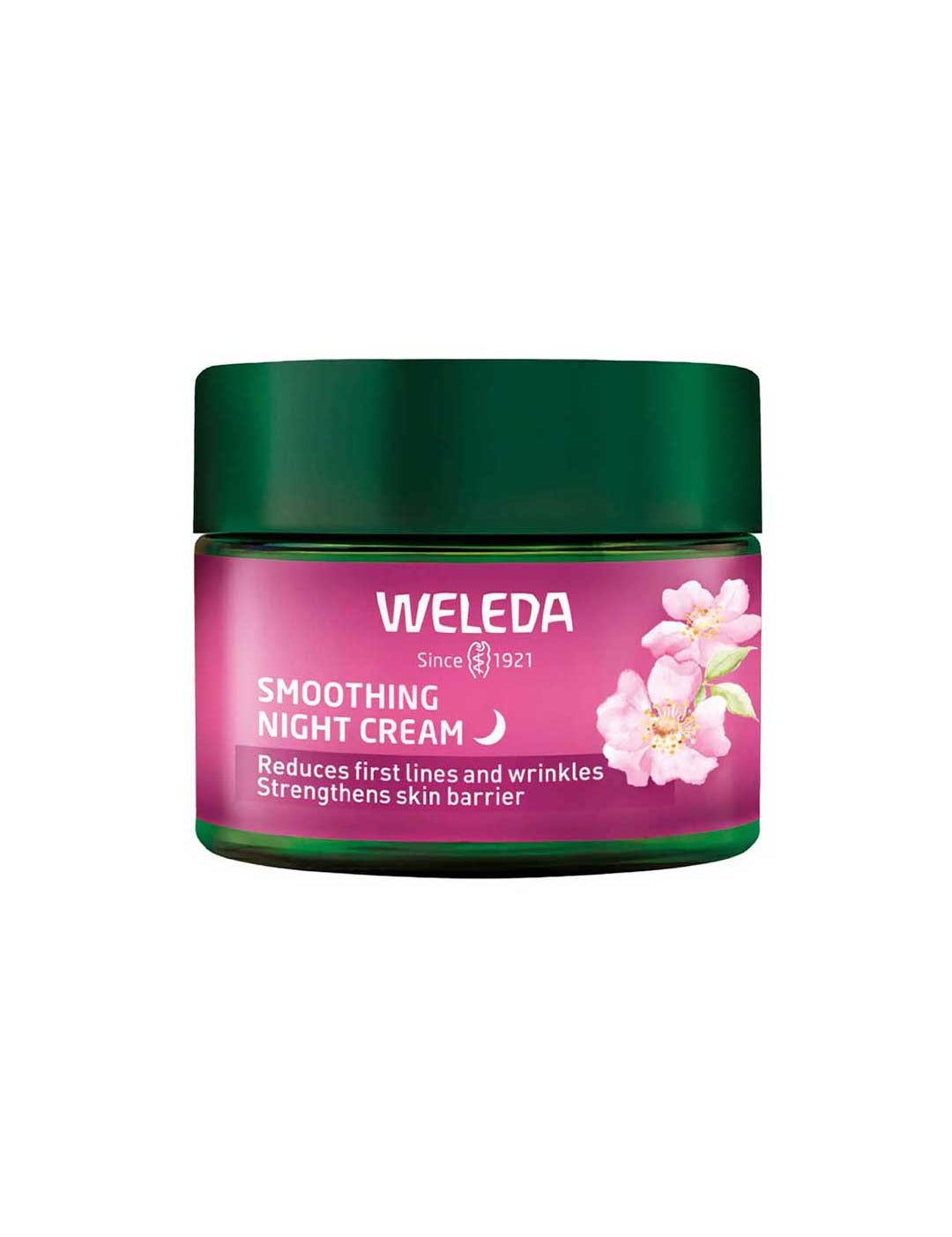 A 40ml jar of Weleda Smoothing Night Cream - Wild Rose & White Tea, with a green lid and pink floral label, hydrates skin, reduces first lines and wrinkles, and helps strengthen the skin barrier for a smoother appearance.