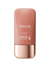 Weleda Sunkissed Bronzing Serum Drops in a flat bronze-brown bottle with rounded corners, a reflective rose-gold base cap and a small gold droplet symbol.
