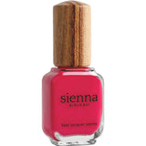 A bottle of Sienna Byron Bay Nail Polish - Wonder, a fuchsia pink, plant-derived polish with a wooden cap, shown against a white background.