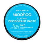 Woohoo all natural deodorant paste container with blue label and Surf regular strength branding  on a white background