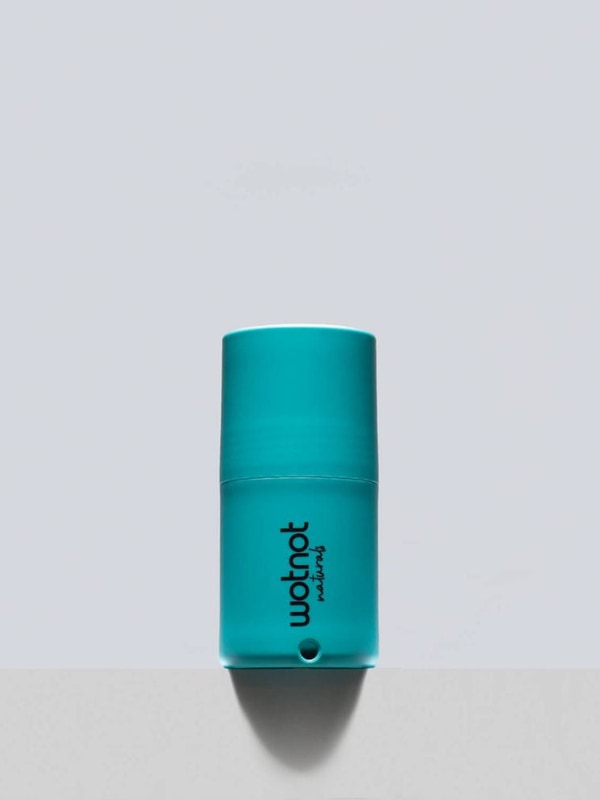 Wotnot refillable sunscreen roll-on applicator in use