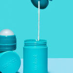 Wotnot refillable sunscreen roll-on applicator being applied to skin