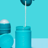 Wotnot refillable sunscreen roll-on applicator being applied to skin