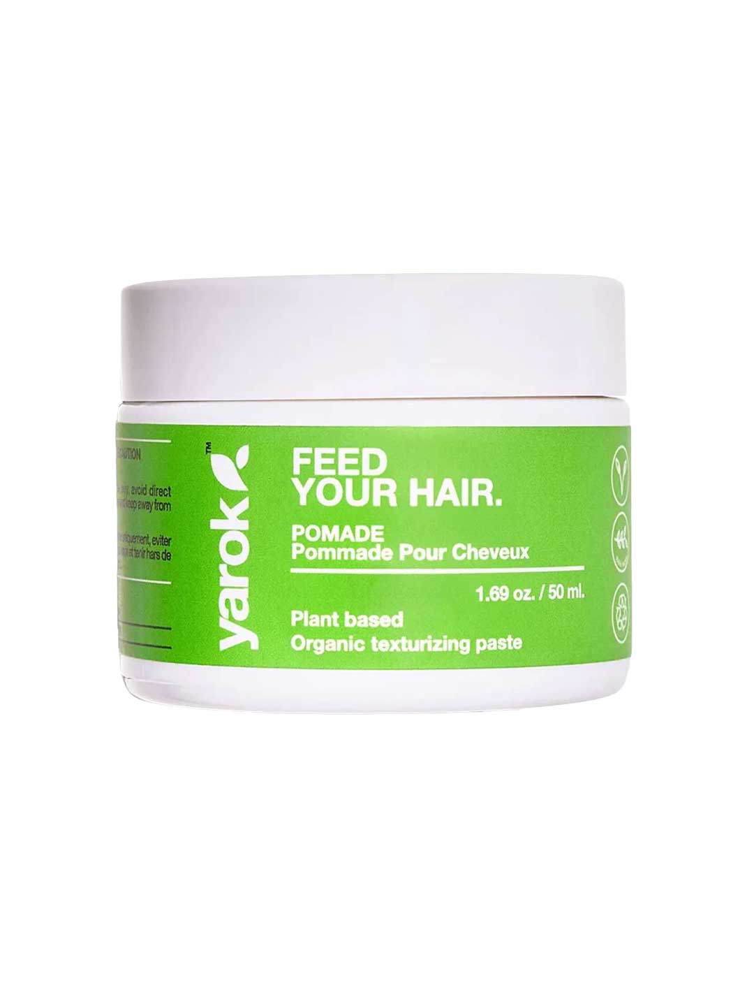 A white plastic jar of Yarok Feed Your Hair Pomade with a bright green label, set against a plain white background.