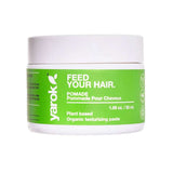 A white plastic jar of Yarok Feed Your Hair Pomade with a bright green label, set against a plain white background.