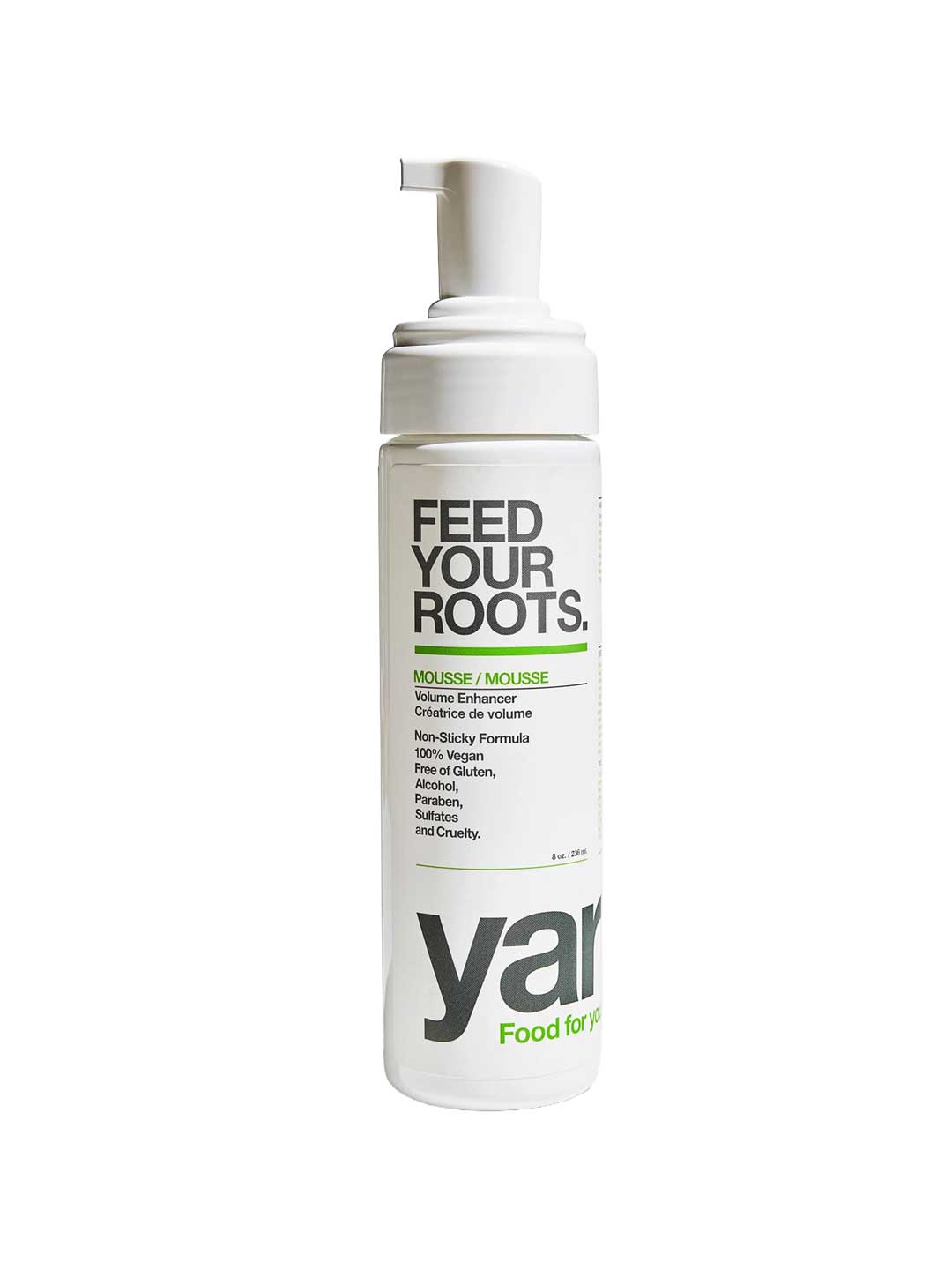 A white pump bottle of Feed Your Roots. volume enhancer with black and green text, on a solid white background.
