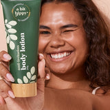 A bit Hippy Body Lotion held by a smiling woman