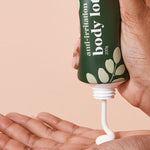 A bit Hippy Body Lotion dispensed into a hand