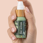 A bit Hippy Day Serum bottle held in hand