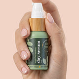 A bit Hippy Day Serum bottle held in hand