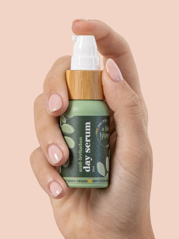 A bit Hippy Day Serum bottle held in hand