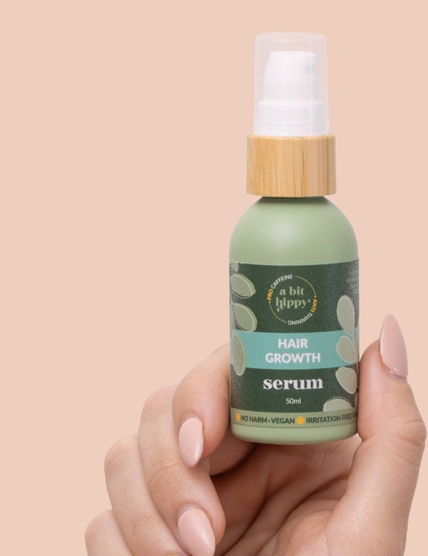 A bit Hippy Hair Growth Serum held in hand