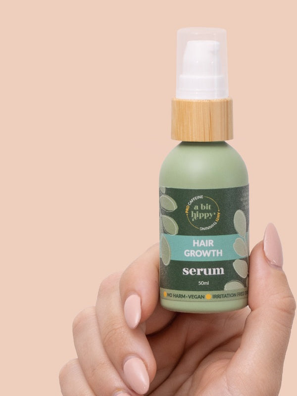 A bit Hippy Hair Growth Serum held in hand