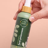 A bit Hippy Heat Protectant Spray held in hand
