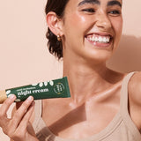 A bit Hippy Night Cream held by a smiling woman