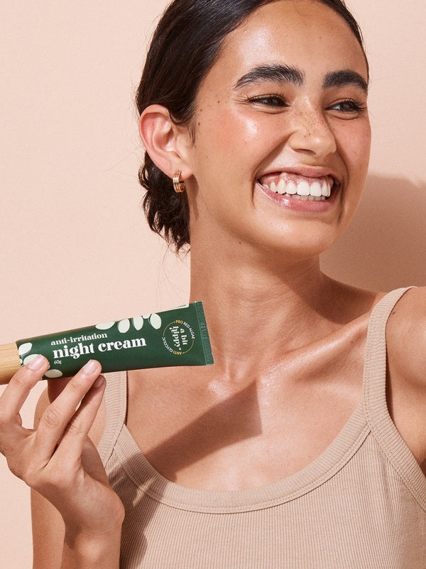 A bit Hippy Night Cream held by a smiling woman