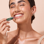 A bit Hippy Tinted Pomegranate Lip Balm being applied