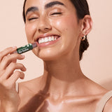 A bit Hippy Tinted Pomegranate Lip Balm being applied