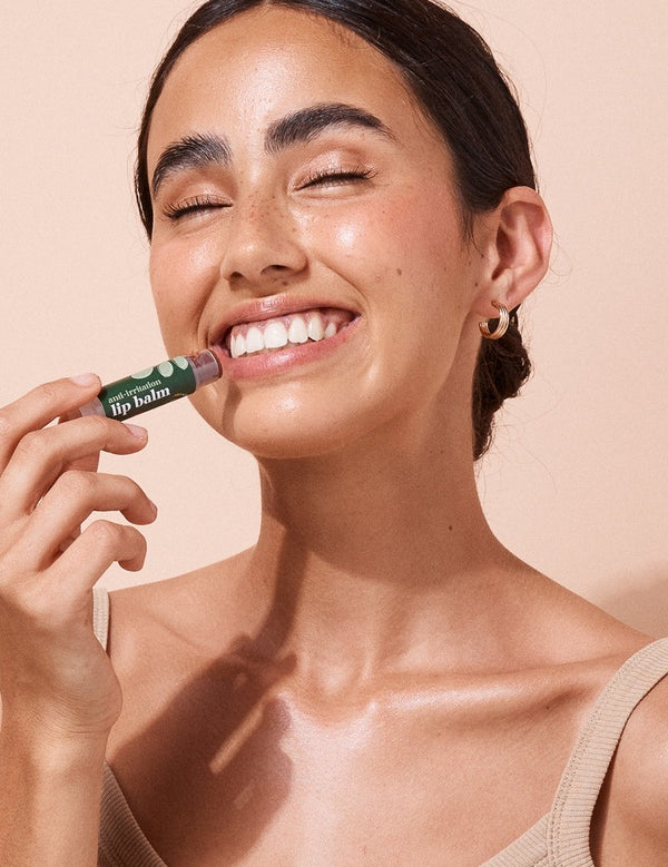 A bit Hippy Tinted Pomegranate Lip Balm being applied