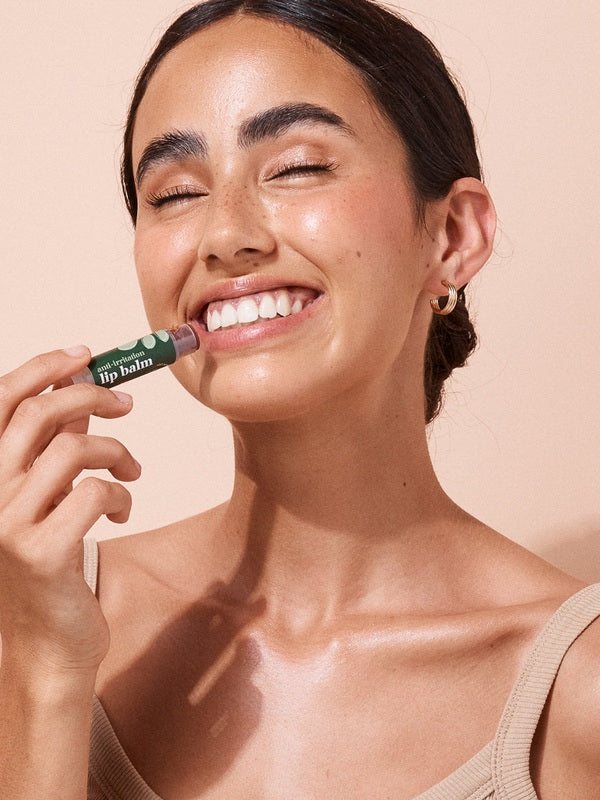 A bit Hippy Tinted Pomegranate Lip Balm being applied