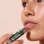 Close-up application of A bit Hippy Tinted Pomegranate Lip Balm