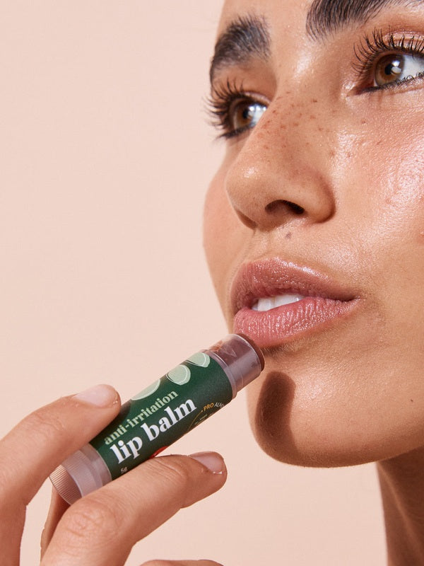 Close-up application of A bit Hippy Tinted Pomegranate Lip Balm