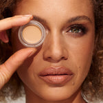 Model wearing INIKA Organic Full Coverage Concealer