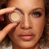 Model wearing INIKA Organic Full Coverage Concealer