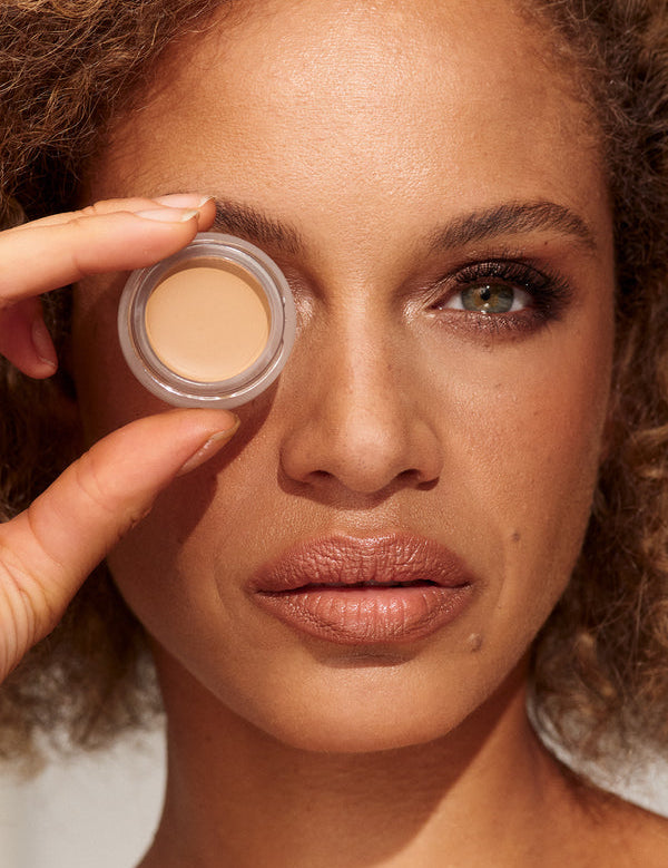 Model wearing INIKA Organic Full Coverage Concealer